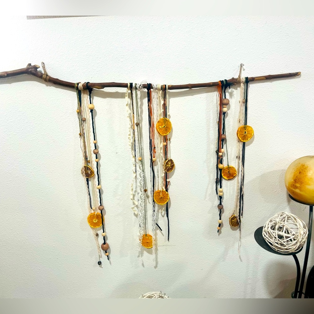 Handmade wooden wall decor with dried citrus